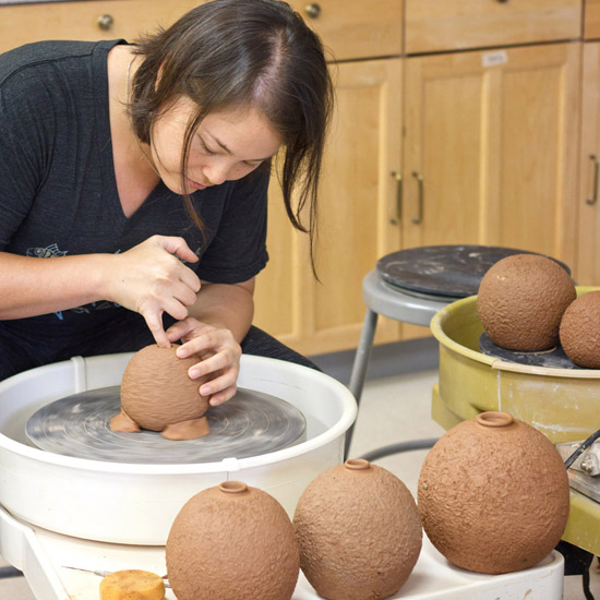 Artist Emily Miller making Lava Pots