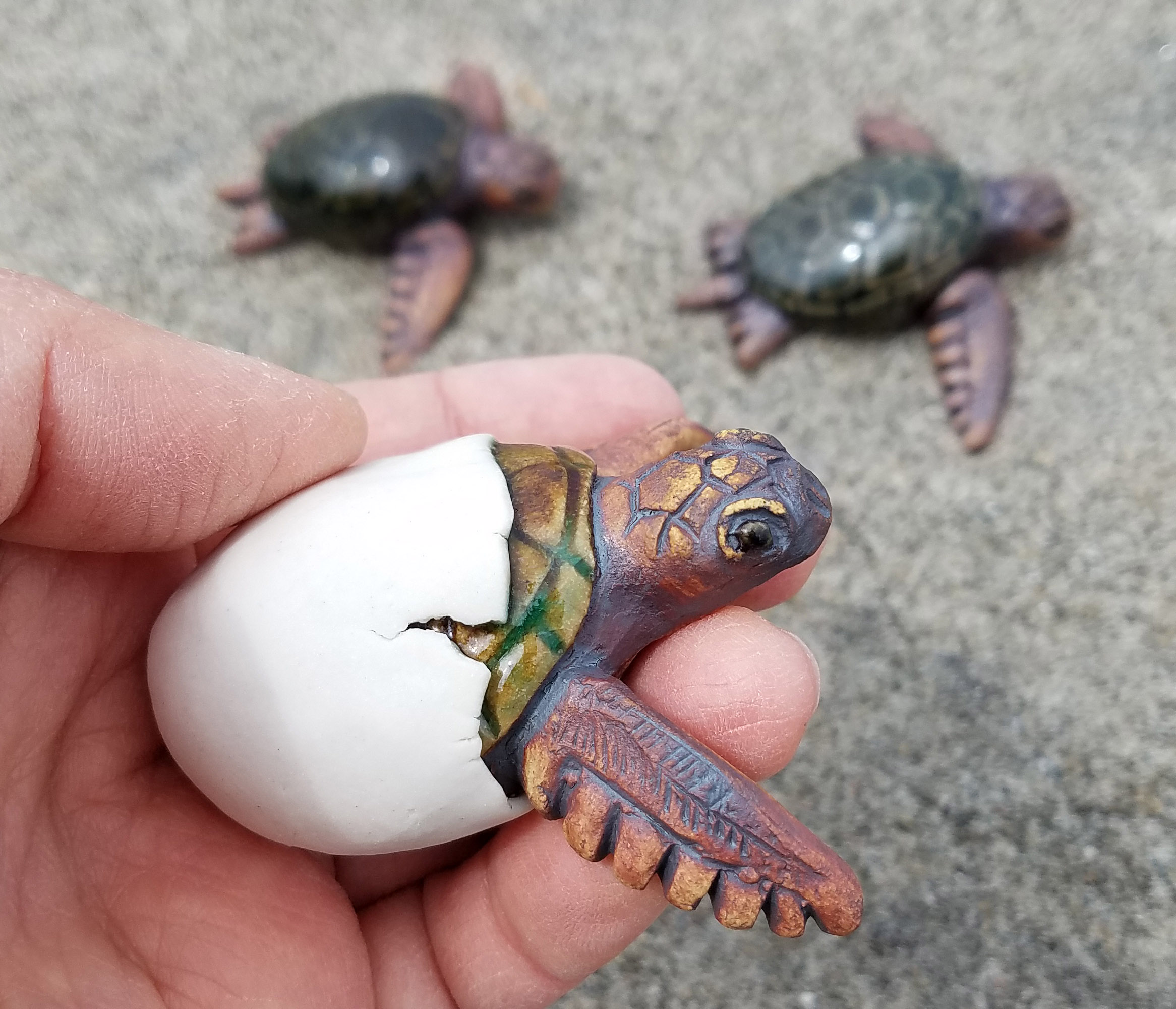 Ceramic sea turtle hatchling handmade sculpture by Emily Miller