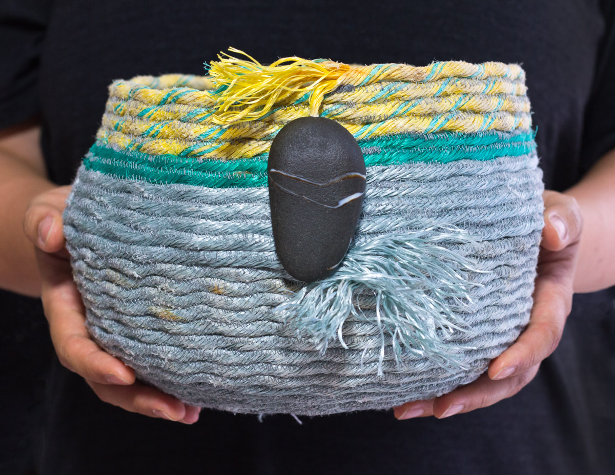 Ghost net fishing rope basket, recycled fiber art sculpture by Emily Miller