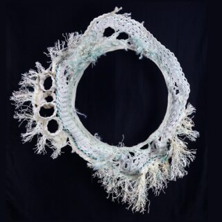 Moon Gate
47" x 43" x 11"
Reclaimed fishing rope, thread, steel wire
2024

Featured artwork in PASSAGE, solo exhibit on display thru July 25, 2025 in the Gladys Valley Marine Studies building at Hatfield Marine Science Center, Newport, Oregon.

Show catalog link in my bio or visit emilyjungmiller.com/exhibits/passage

This was my final piece created in 2024. It has been a tough few months for me, and even more for those most vulnerable in our world. I find myself returning to my study of the moon for grounding, connection, strength. White brings light, something I have been struggling to find, to create some tiny amount of balance. White is also the color of grief in Chinese tradition. I'm grateful for the many kindnesses of the many humans who have supported and shared in this ongoing work 🖤
.
.
.
#ghostnetart #reclaimedmaterials #ghostnetbaskets #recycledart
#contemporarysculpture #fiberart #basketry #portlandartist #oregonartist #oregoncoast 
#pdxartist #oceanplastic #fishingrope