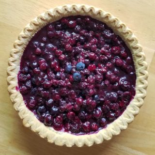 This blueberry pie is one of my favorite "memory meals" from my grandmother. She taught me to eat it for breakfast, and to use Remy Martin cognac in the recipe. It's a true summer recipe with 4 cups of fresh Maine blueberries. She made it every year on Deer Isle. When I make this pie, I remember so many small and specific things about our time together. I make it now with Oregon blueberries from our backyard, which are not the same as Maine berries, but still delicious.

This week's full moon marks the Hungry Ghost Festival, the midpoint of Ghost Month in China, a time when the dead are present among us. Some shops close for the day, to leave space on the streets for the ghosts. Plates of fresh fruit and other foods are left out to nourish the ghosts, who are able to enjoy food and drink during this time. Public festivals and private meals set out chairs and table settings for the ghosts to join us. It is a way to hold space for the dead, to acknowledge their presence among us, whether our understanding of this is literal or symbolic.

In the past year of working on 1000 Moons, I've had many conversations about the importance of memory meals. Food is a powerful connection. Our physical bodies remember with all our senses, the smell, taste, appearance, motions, and sounds of preparing and consuming the food and drink we had enjoyed together. It can be a way to process loss without words, to process with our whole bodies, to celebrate, to reconnect, to grieve. 
.
.
.
#1000moonsgriefprocess #oregonartist #portlandartist #pdxartist #griefritual #griefprocess #memorymeals #blueberrypie